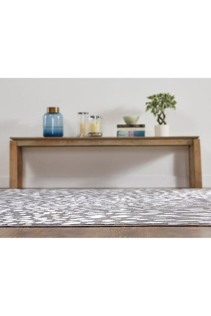 Buy Serengeti- Charcoal Spotted Rug in Grey Online Grey